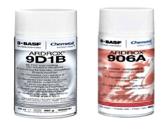 Two aerosol cans of penetrant testing consumables