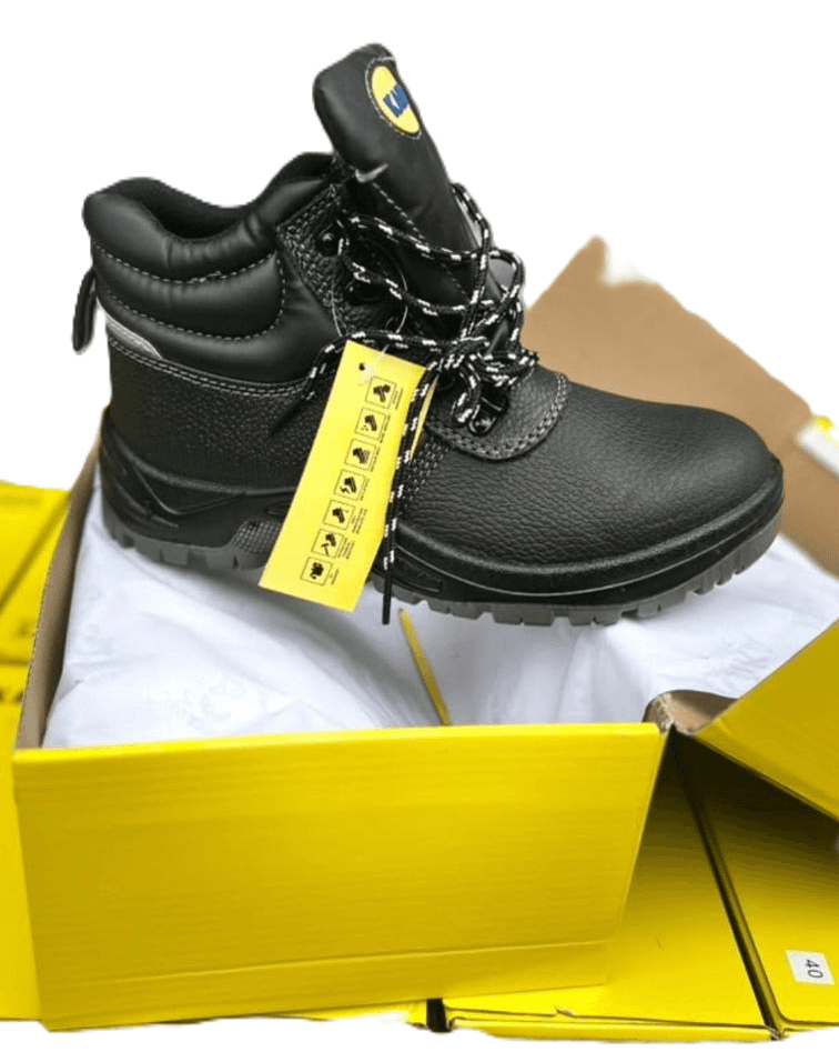 Black leather safety boot in its box, with a tag attached